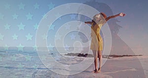 Multiple star icons against african american woman enjoying on the beach