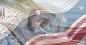 Multiple stars on blue stripes against portrait of caucasian woman lying on hammock at the beach