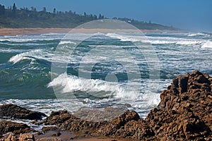 MULTIPLE SWELLS ON THE SEA PUSHING OUT TO THE SHORE