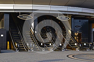 Multiple tall long escalators at the entrance of a luxury Casino Hall