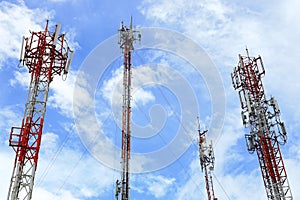 Multiple Telecommunication Towers with blue sky