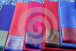 Multiple varieties of handwoven silk sarees in vibrant colors