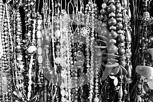 Multiples necklaces with pearls, seeds, stones and other materials. Different shapes, colors and sizes. [Black and White version]