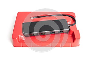 Black USB-C hub in red retail box Isolated on white
