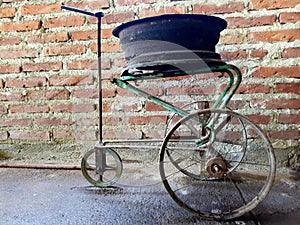 Multipurpose wheeled gadget, made from recycled materials photo