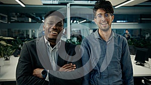 Multiracial business colleagues smiling diverse men arabian and african businessmen co-workers employees stand in office