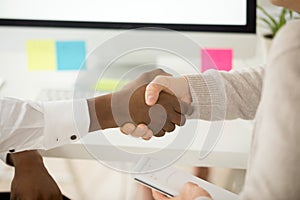 Multiracial business handshake as concept of help support in tea