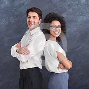 Multiracial business man and woman against gray background