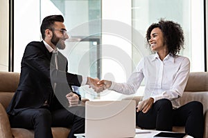 Multiracial business partners handshake get acquainted at meeting