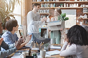 Multiracial business team greeting newcomer young girl