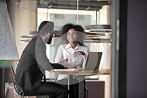 Multiracial businesspeople discuss business ideas at office meeting