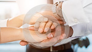 multiracial businesspeople stacking hands each other. High quality photo