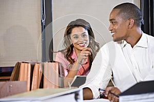 Multiracial businesspeople working on documents