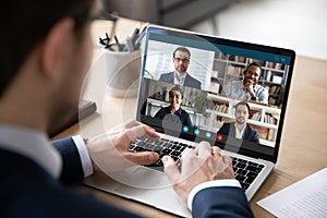 Multiracial colleagues engaged at group meeting online laptop screen view