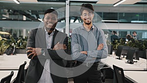 Multiracial couple of business colleagues smiling diverse co-workers arabian young man african manager businessman guy