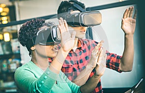 Multiracial couple in love playing with vr virtual reality goggles photo