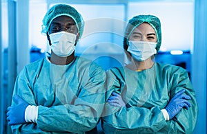 Multiracial doctors wearing personal protective equipment fighting against corona virus outbreak