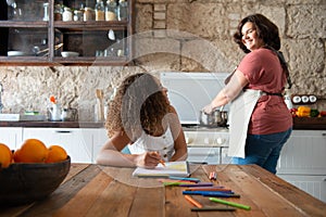 Multiracial family sharing their time in the kitchen of the home