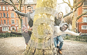 Multiracial fancy friends having fun outdoors at city park