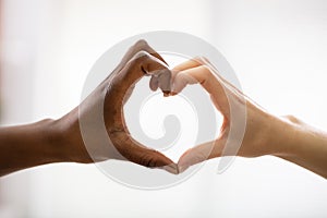 Multiracial Female Friend's Hands Showing Heart Shape