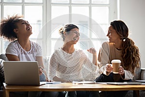 Multiracial female students having fun at meeting at home.