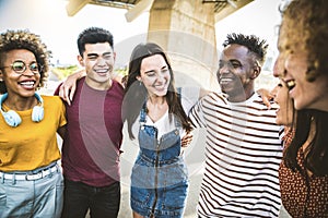 Multiracial friends group having fun on city street