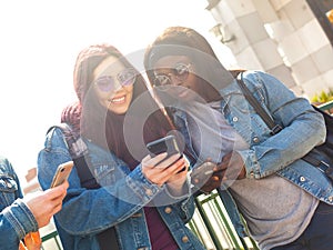 Happy multiracial friends in a spring day
