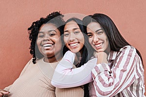 Multiracial friends having fun together outdoor - Focus on faces