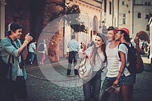 Multiracial friends tourists in an old city