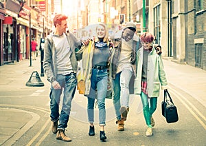 Multiracial friends walking on Brick Lane in London Shoreditch