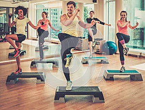 Multiracial group during aerobics class in a gym