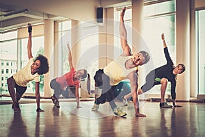 Multiracial group doing aerobics exercise