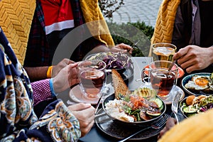 Multiracial group of friends having a drink together