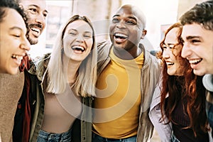 Multiracial group of friends having fun together on city street