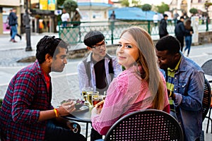 Multiracial group of friends having lunch together