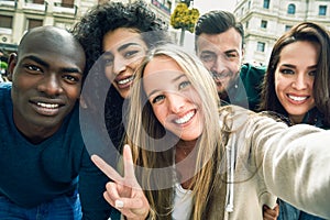 Multiracial group of young people taking selfie