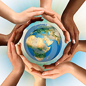 Multiracial Hands Surrounding the Earth Globe photo