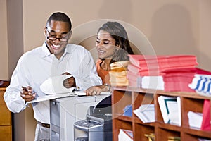 Multiracial office workers working on documents