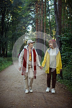 Multiracial old women having a good day in to the wood. Lifestyle and female friendship concept.