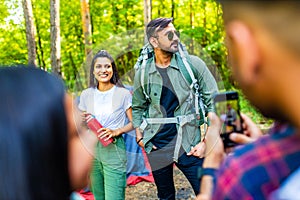 Multiracial pakistanian happy friends at picnic camping park