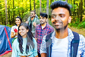 Multiracial pakistanian happy friends at picnic camping park