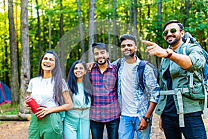 Multiracial pakistanian happy friends at picnic camping park