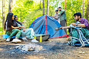 Multiracial pakistanian happy friends at picnic camping park