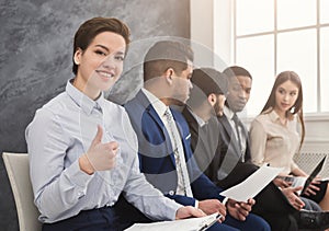 Multiracial people waiting in queue preparing for job interview