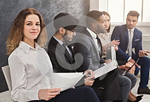 Multiracial people waiting in queue preparing for job interview