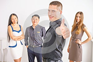 Multiracial successful business people with thumbs up gesture