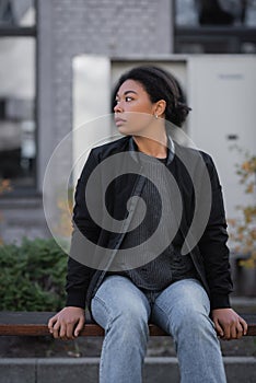 multiracial woman with apathy looking away