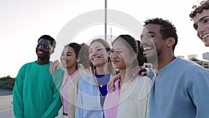 Multiracial young group of happy people bonding outdoors.