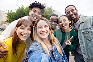 Multiracial young group of people taking selfie portrait on travel vacation