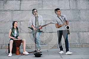 Multiracial young people performing in band